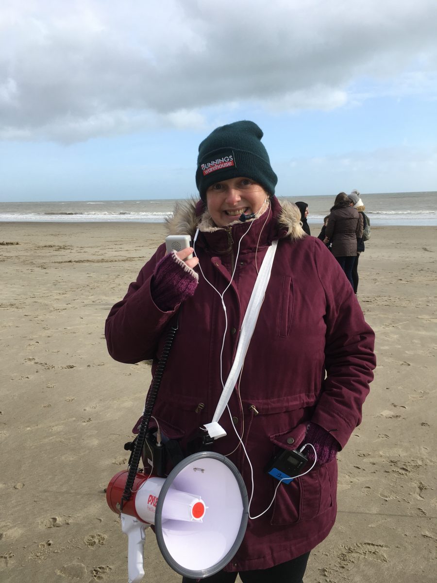 Composer and singer Emily Peasgood at the Beacons site test on Folkestone Sunny Sands Beach, February 2020.