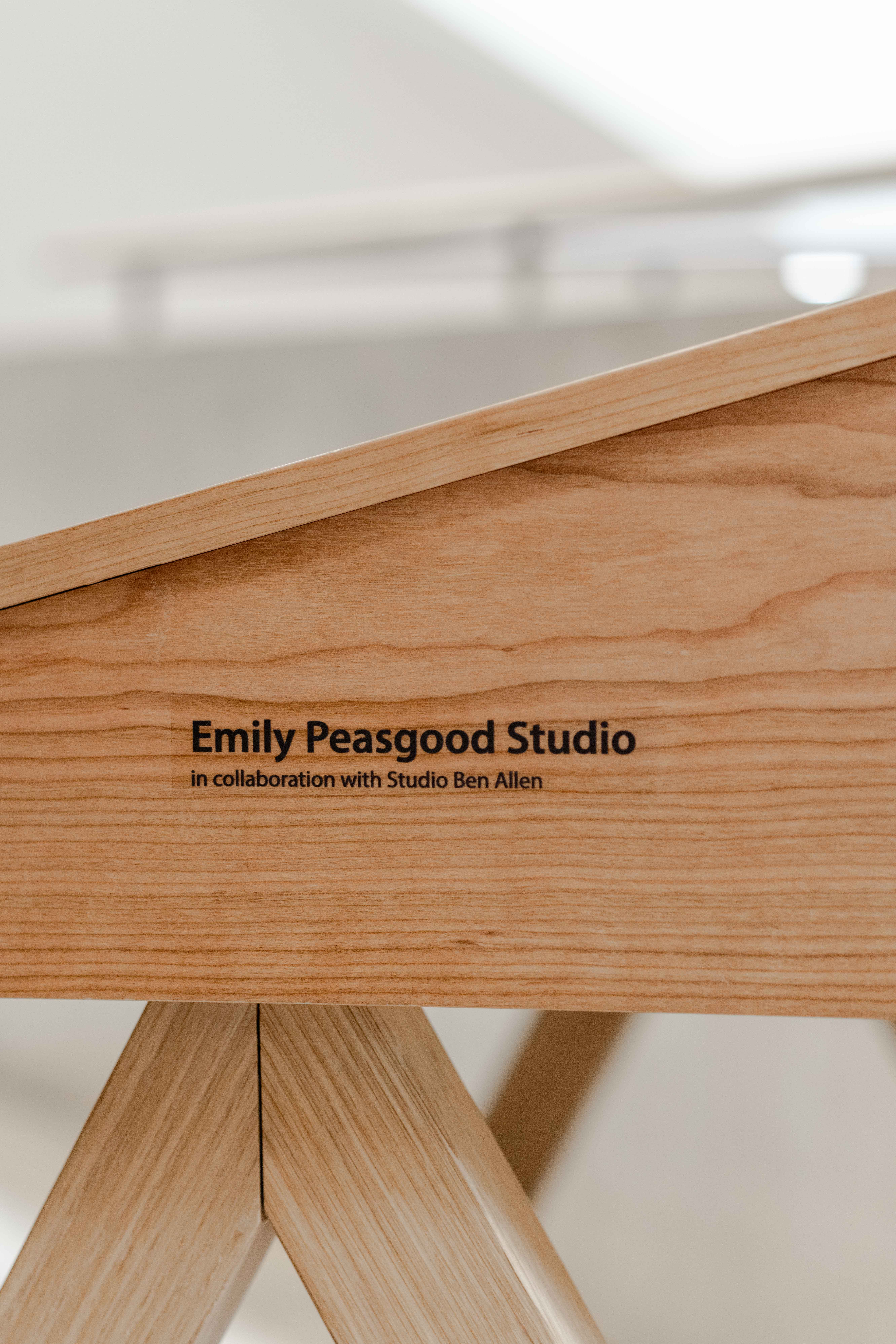 Close up of Emily Peasgood's Listening Desk. Side view of the maker's mark which states: Emily Peasgood Studio, in Collaboration with Ben Allen.